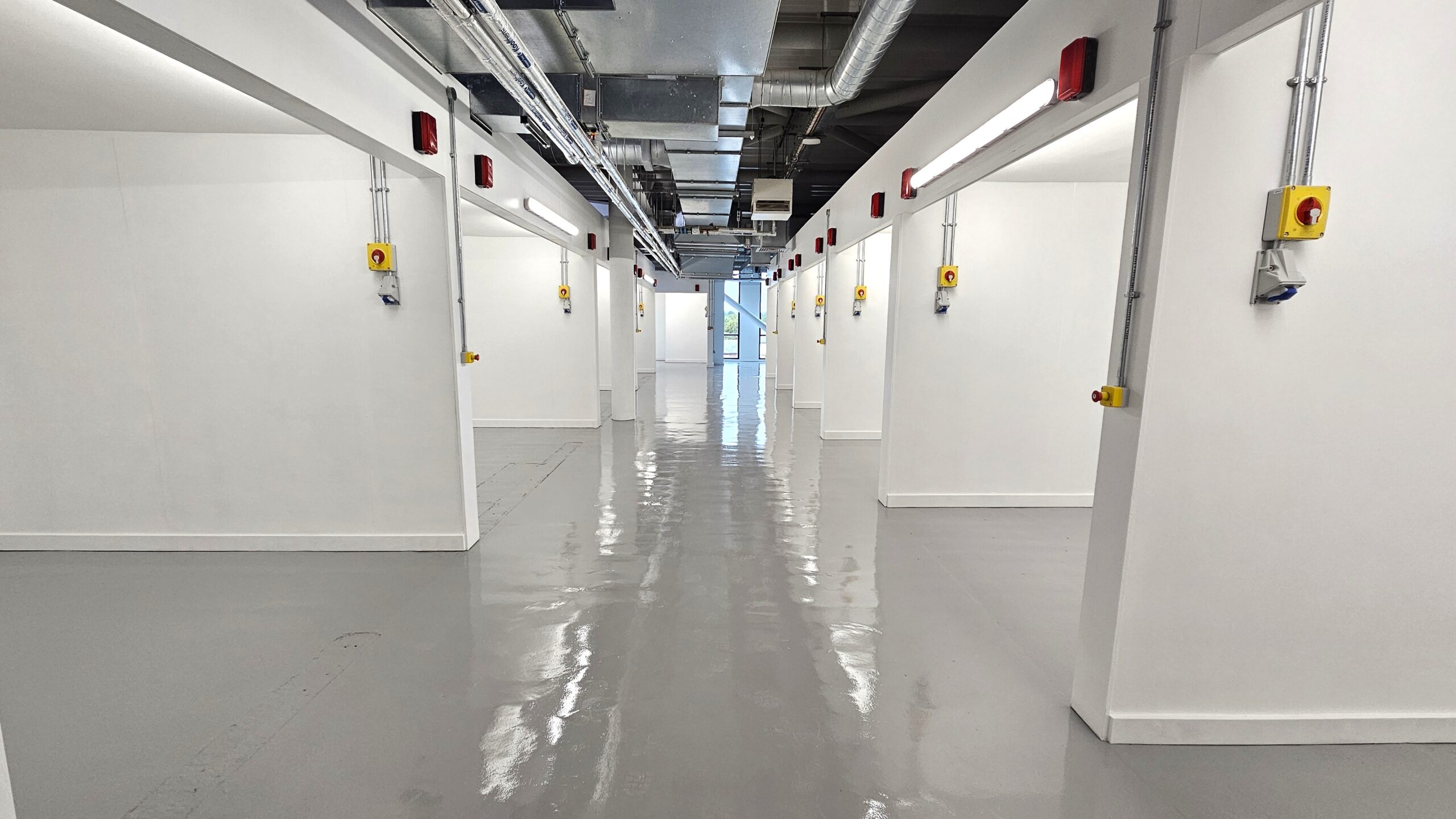 White row of training bays equipped with electrical sockets
