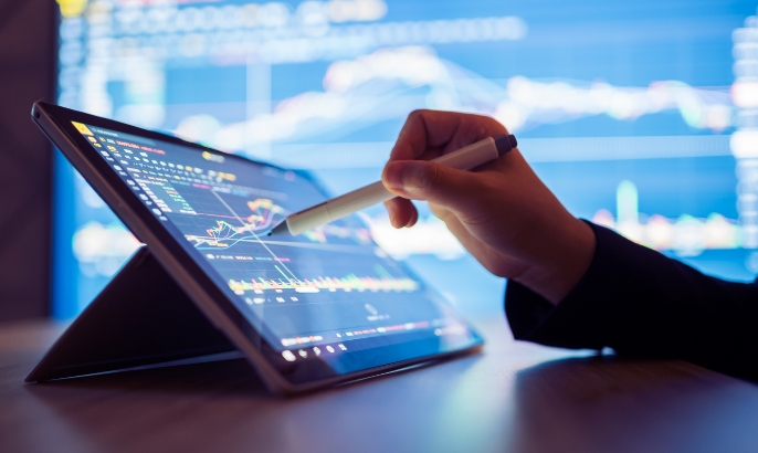 Tablet with someone working on graphs